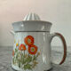 Vintage stoneware jug and its citrus juicer.