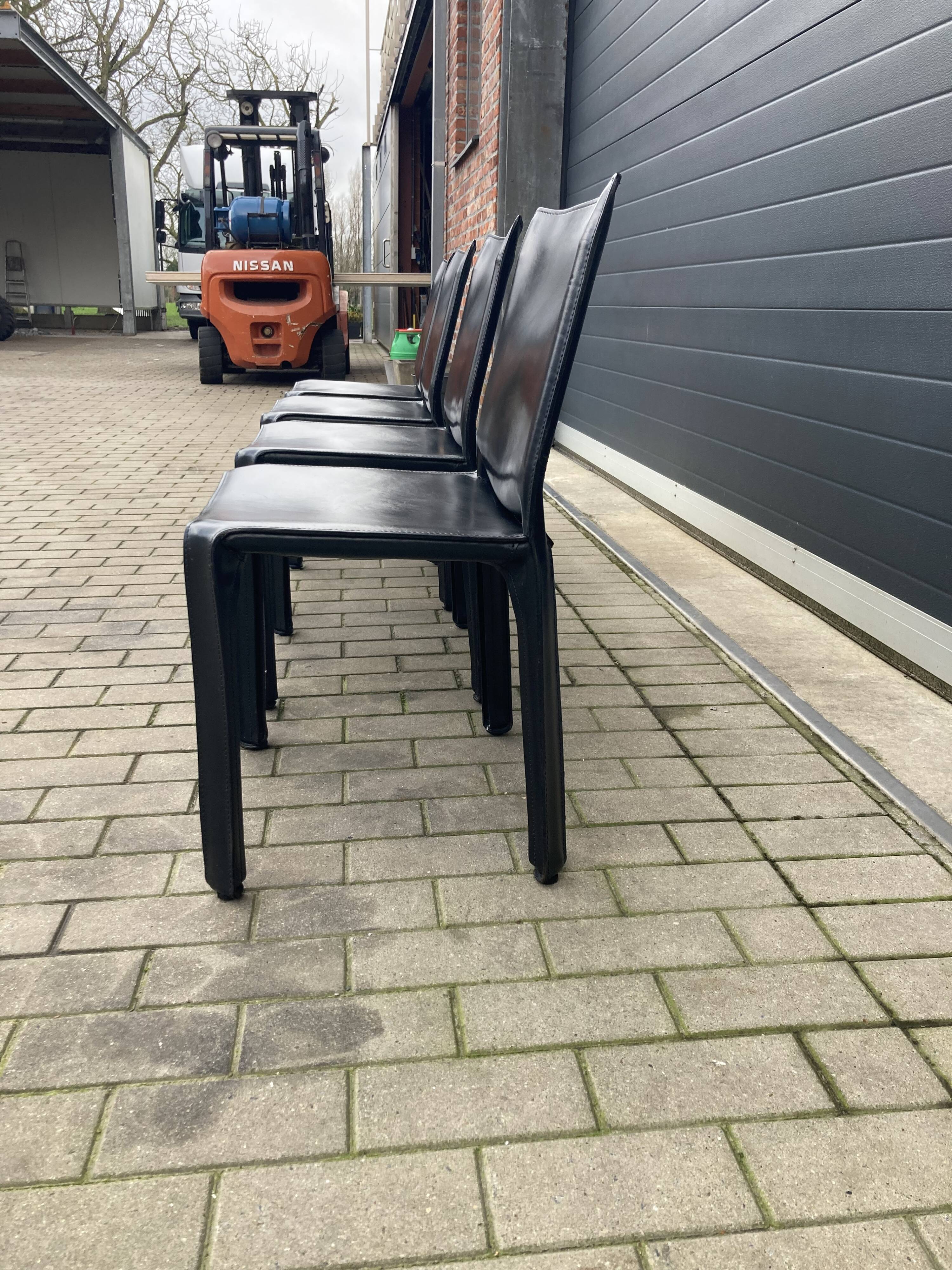 4 black Cassina Cab chairs by Mario Bellini