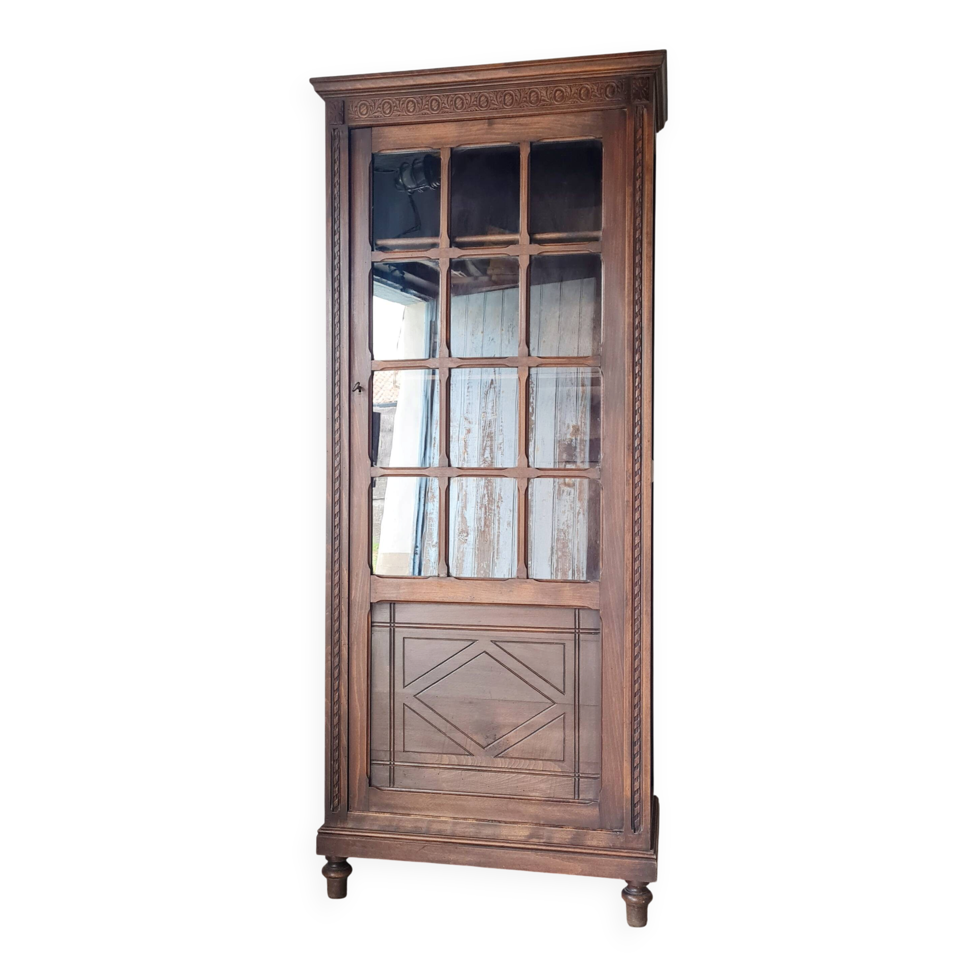 Old glass-fronted library in solid wood