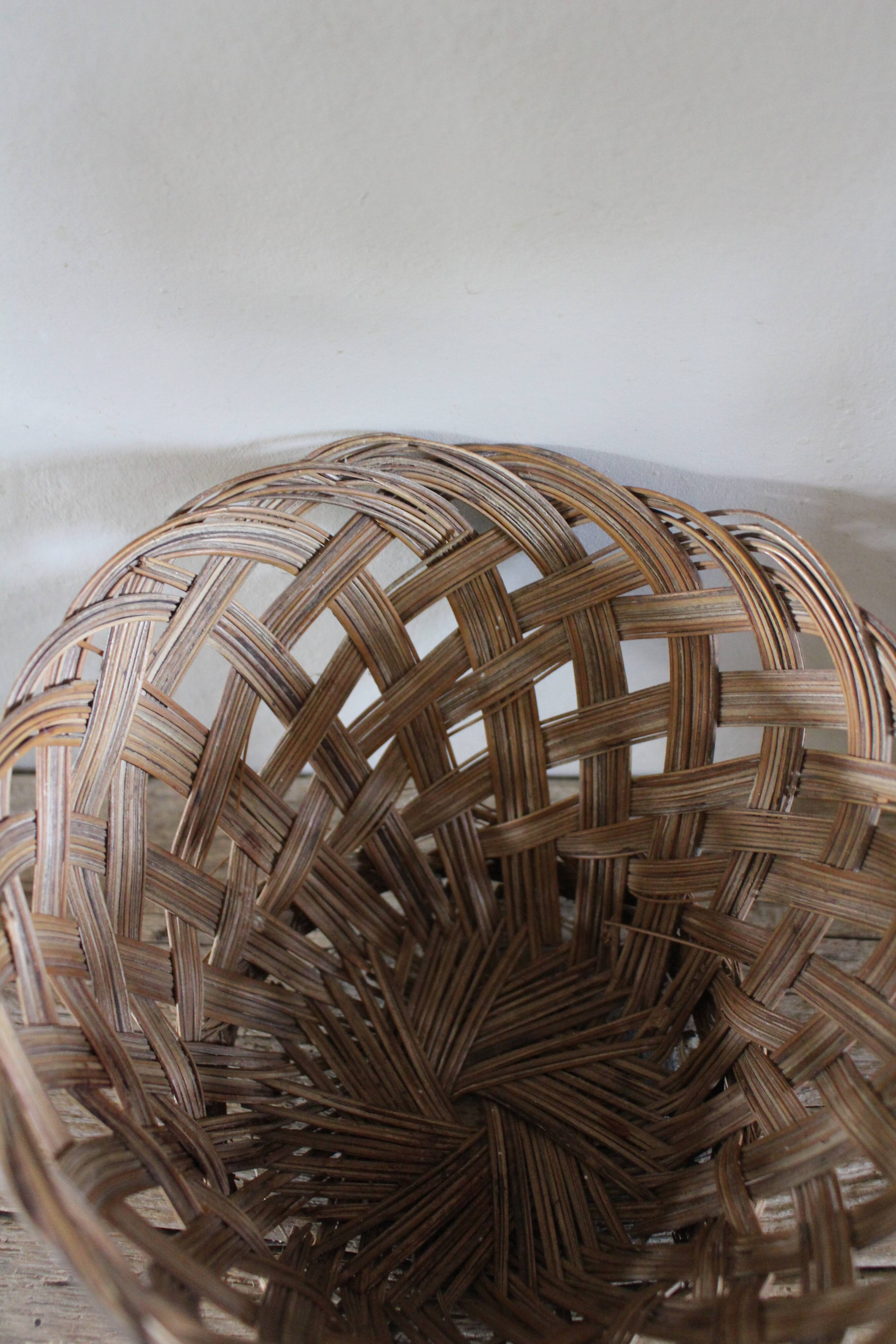 Vintage high round wicker basket with openwork.