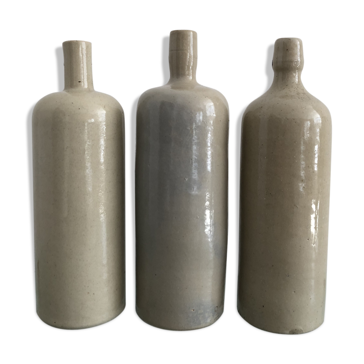 Trio of vintage stoneware bottles