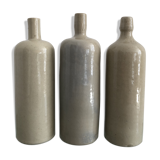 Trio of vintage stoneware bottles