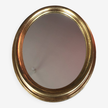 Golden oval mirror