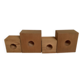 Four Scandinavian wooden candle holders.