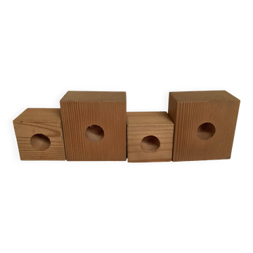 Four Scandinavian wooden candle holders.