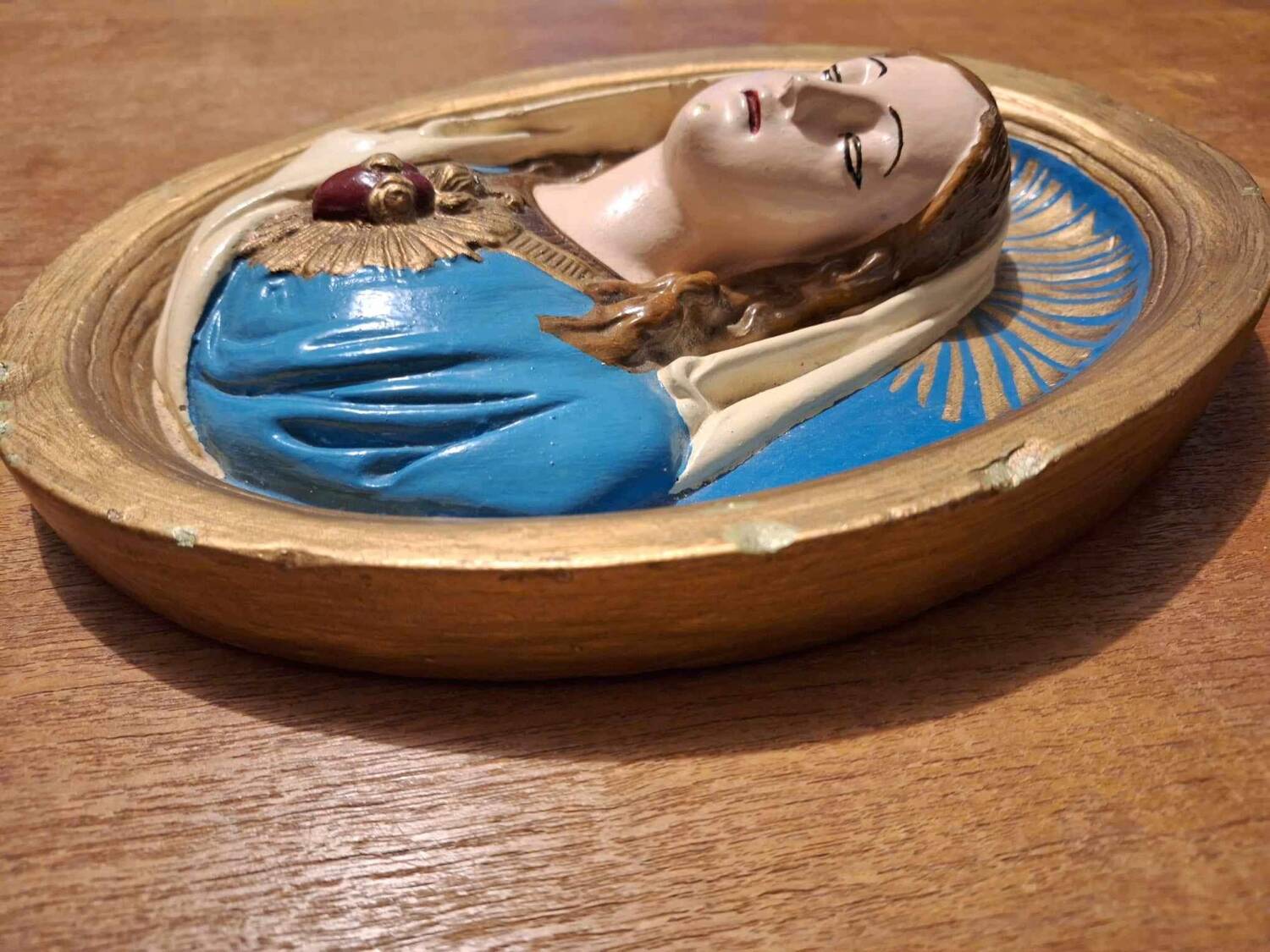 Vintage frame of the Virgin in plaster, old religious painting