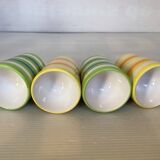 Four striped egg cups in yellow and green.