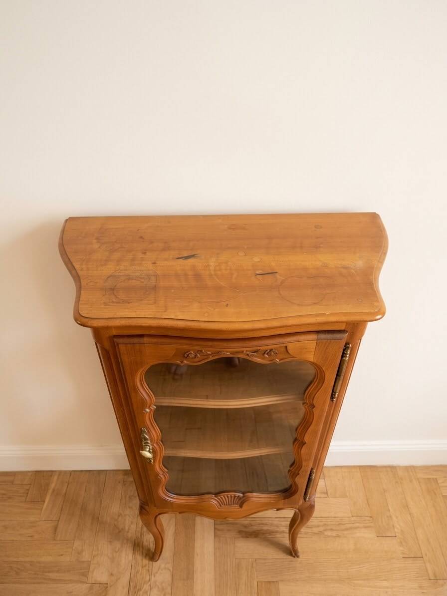 Small silver display cabinet in Louis XV style made of wood.