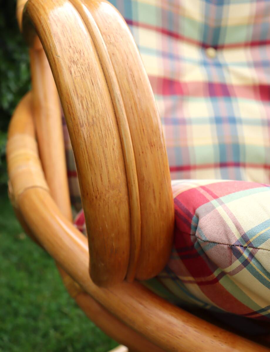 Swivel rattan armchair with matching ottoman