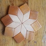Under the geometric wooden plate