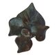 Patinated green brass candlestick with foliage decoration.