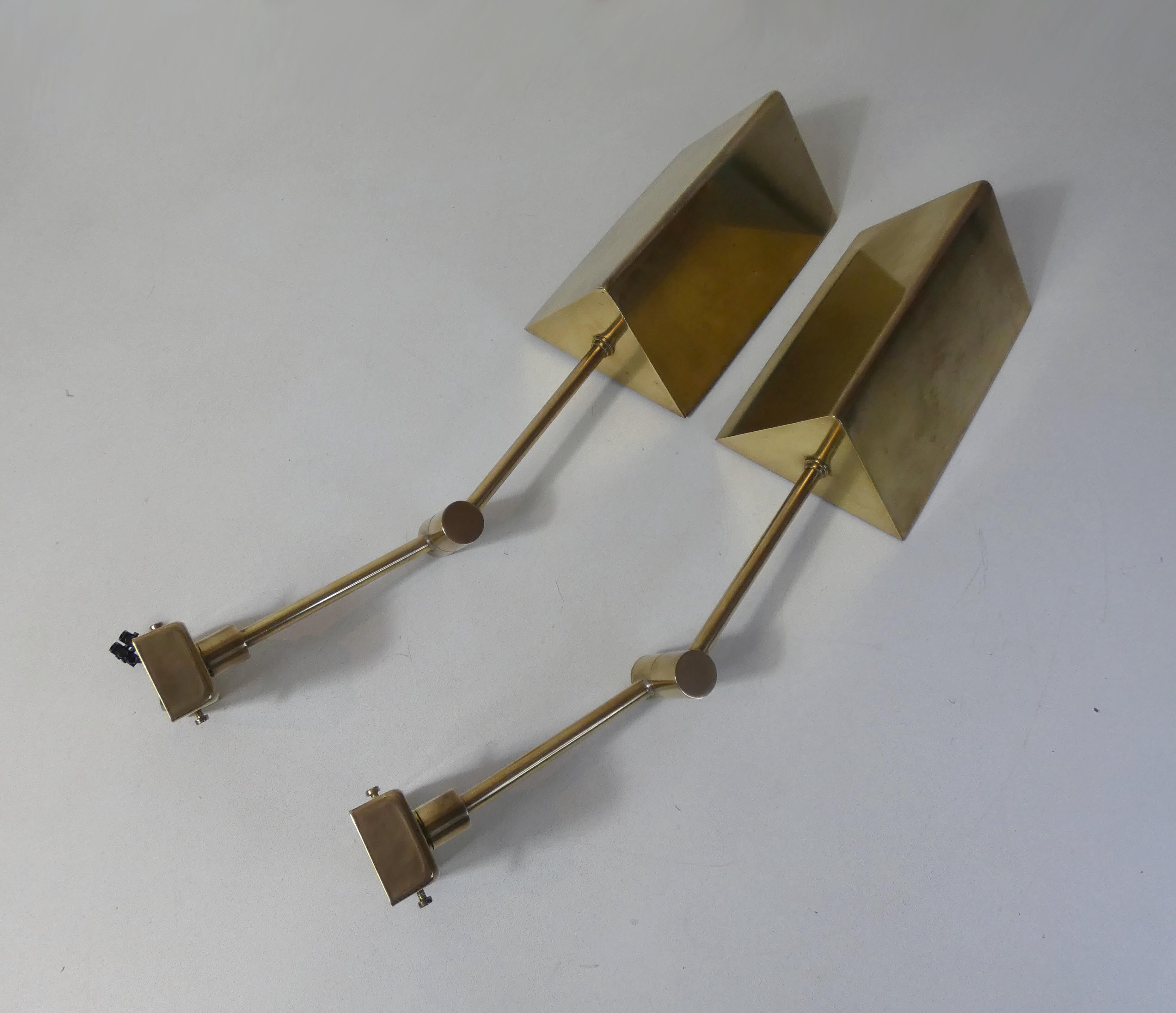 Pair of adjustable brass wall lamps after koch & lowy