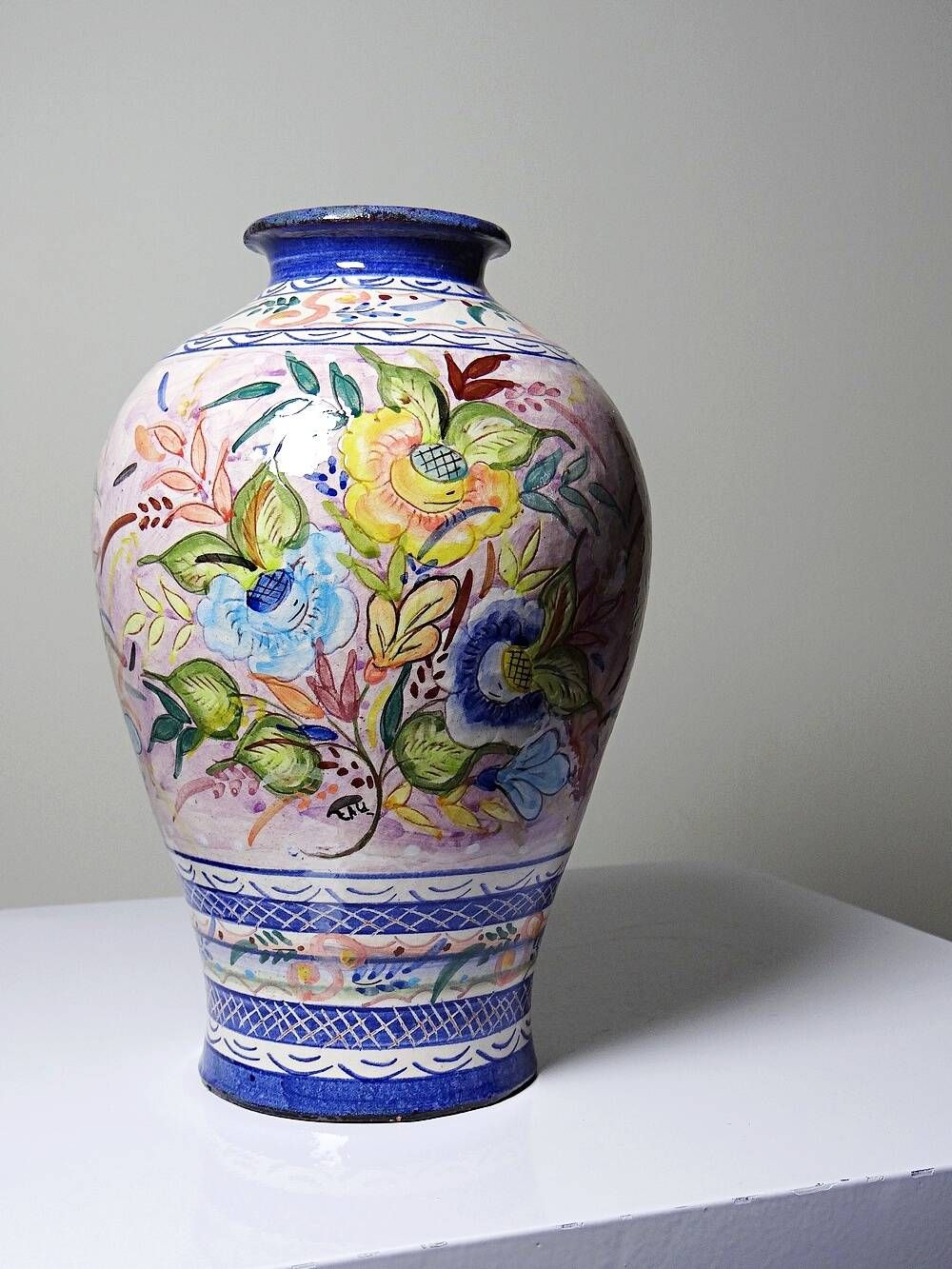 Vintage Portuguese vase in glazed terracotta with hand-painted floral decoration.
