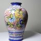 Vintage Portuguese vase in glazed terracotta with hand-painted floral decoration.