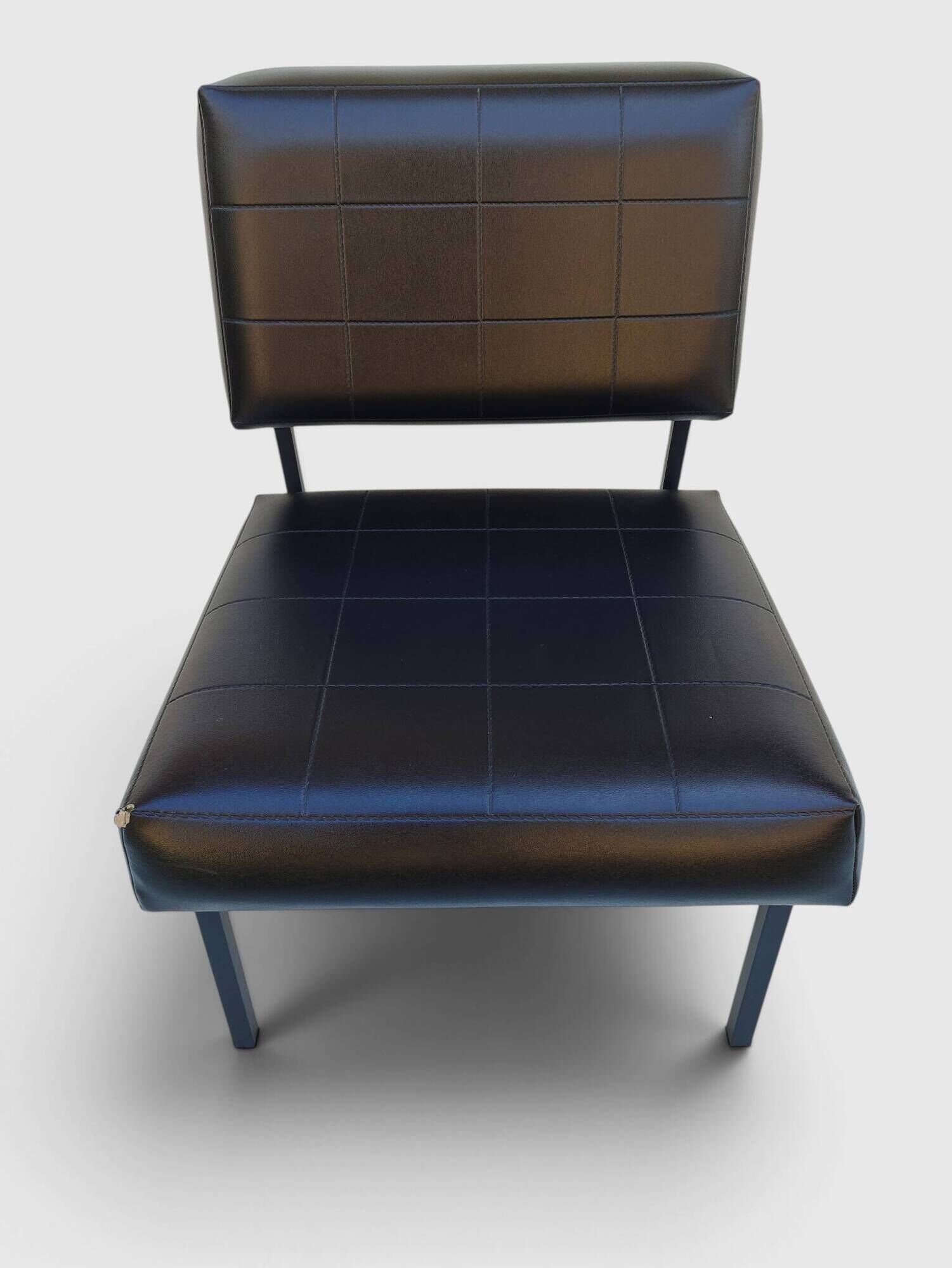 Modernist armchair in black faux leather and metal – 1960s