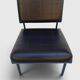 Modernist armchair in black faux leather and metal – 1960s