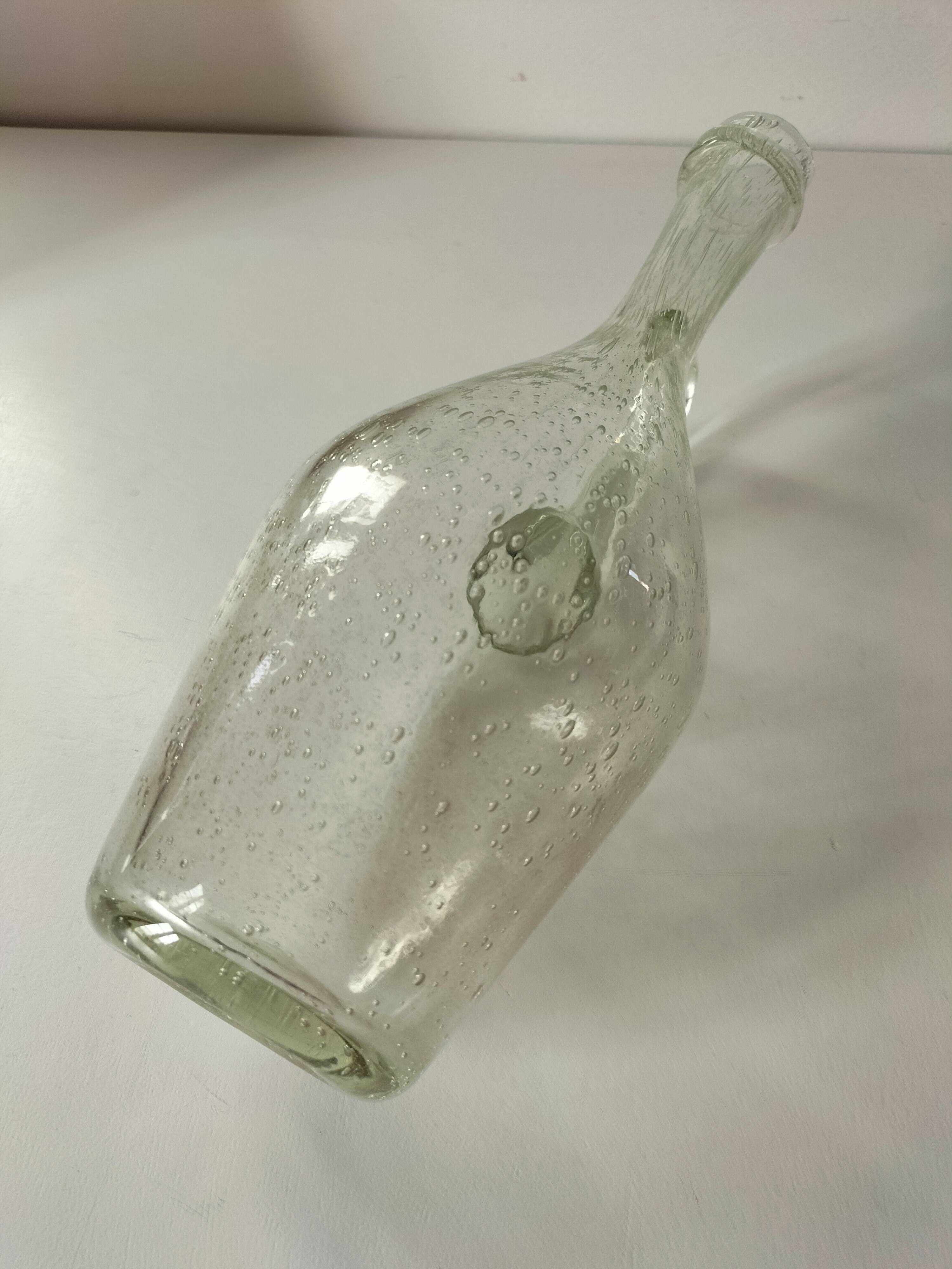 Bubble glass carafe bottle signed Biot in lime green colour.