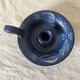 Signed terracotta thumb candle holder