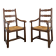 Paire de fauteuils rustiques en chêne assises paillées