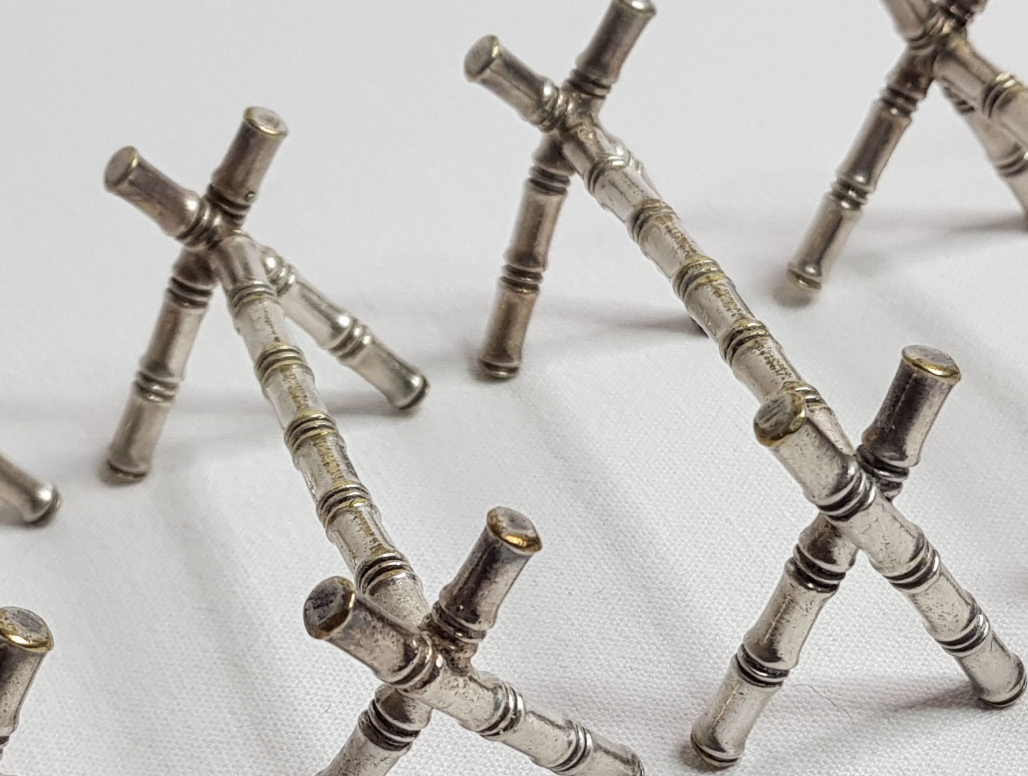 Set of six knife holders in silver metal in imitation of bamboo