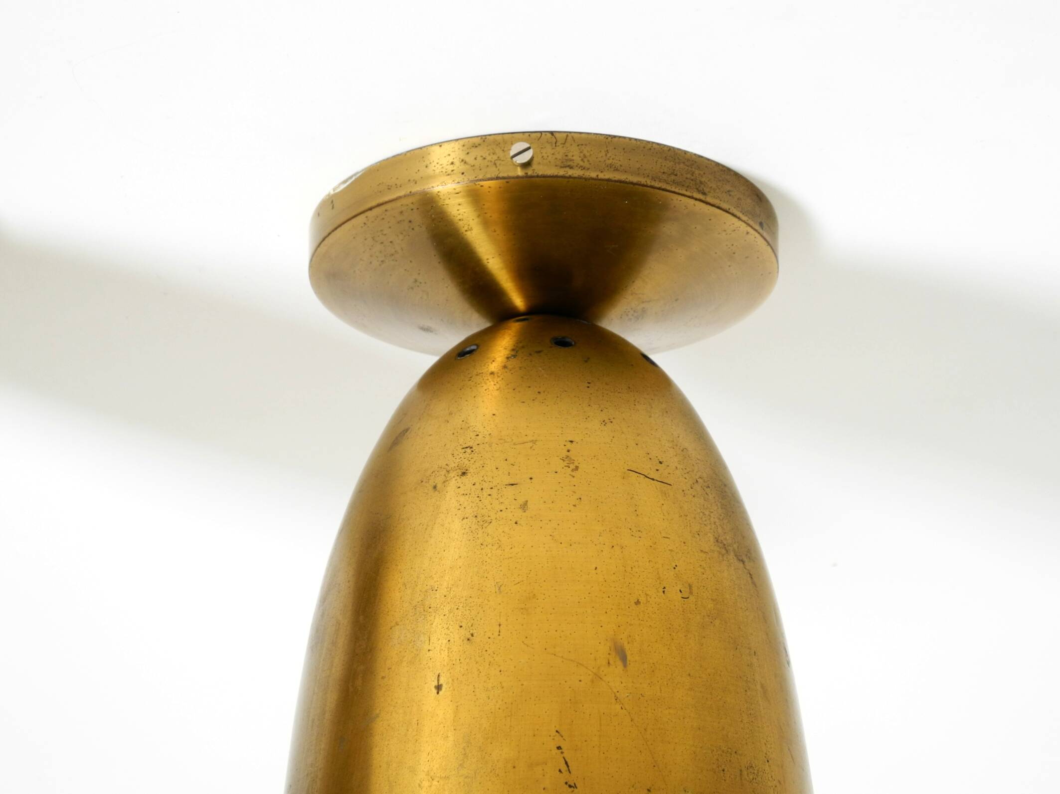 A pair of large, original Mid Century Modern brass ceiling lamps