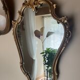 Louis XV Style wood and gilded stucco mirror with animated shape