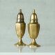Pair of patinated brass salt and pepper shakers, 20th century.
