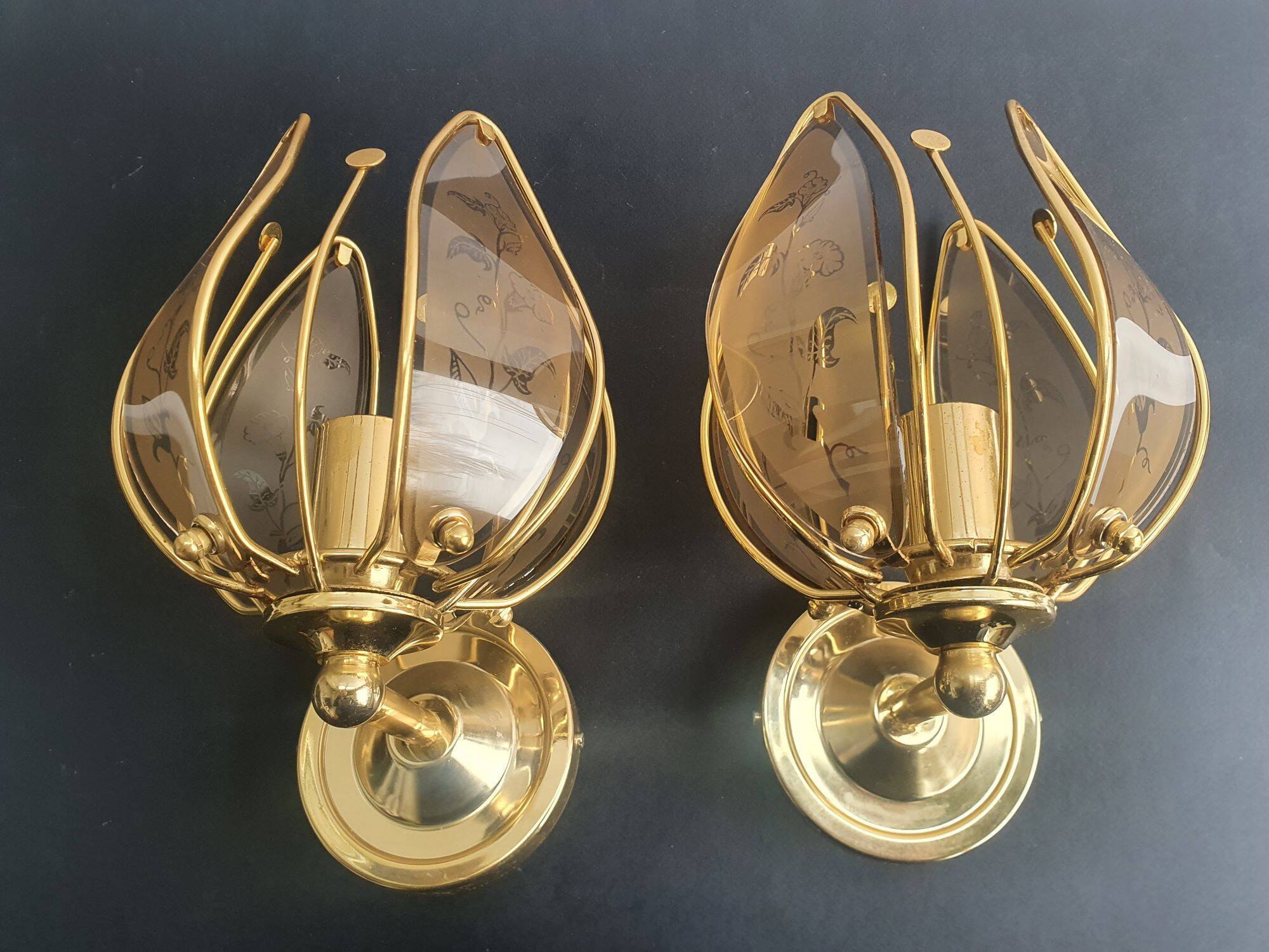 Pair of vintage brass wall sconces with glass shades