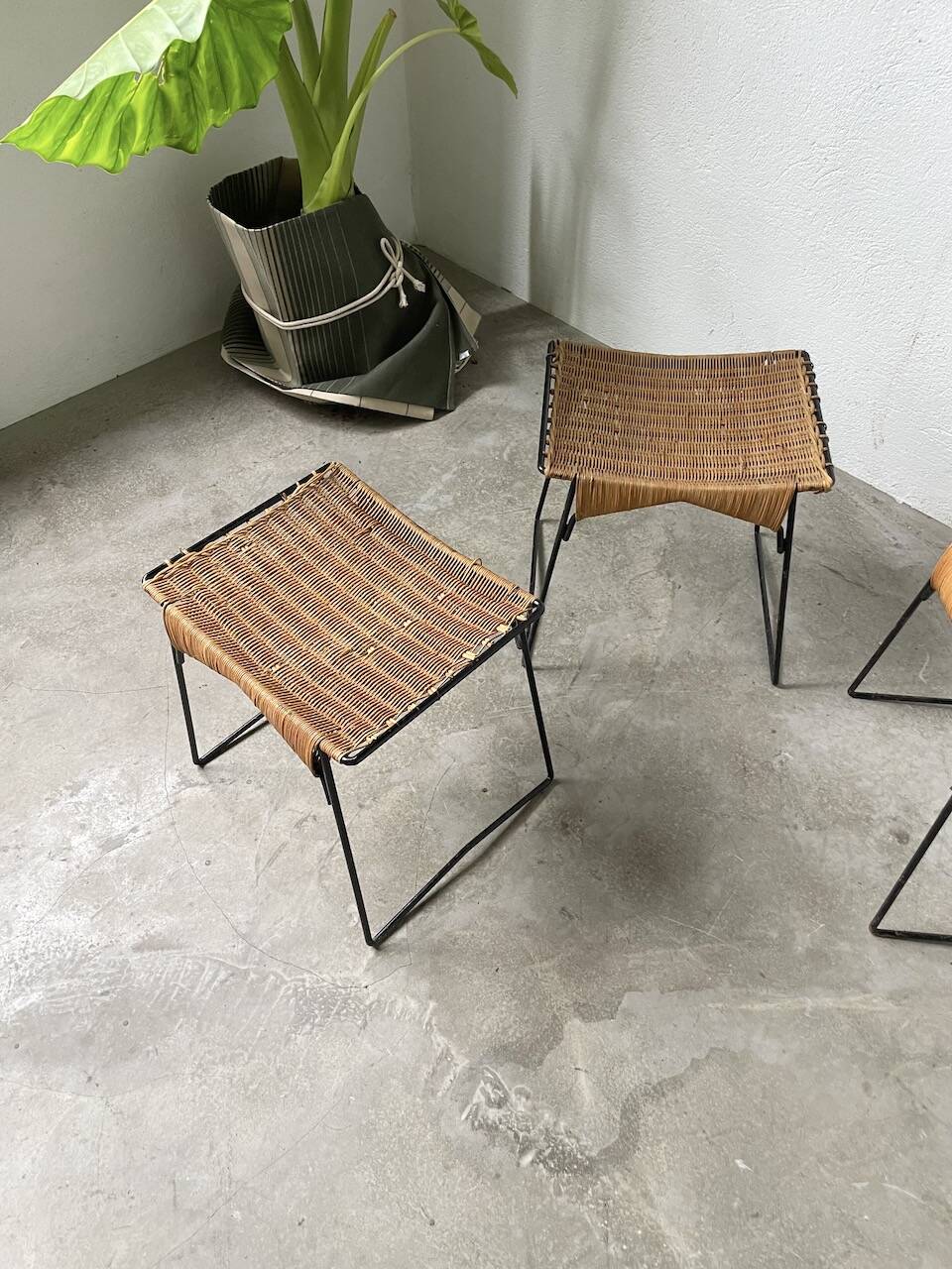 Set of three Raoul Guys wicker and metal stools