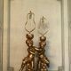 Two carved wooden children, table lamps.