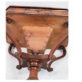 Antique mahogany sewing table on a pillar from around the year 1840s