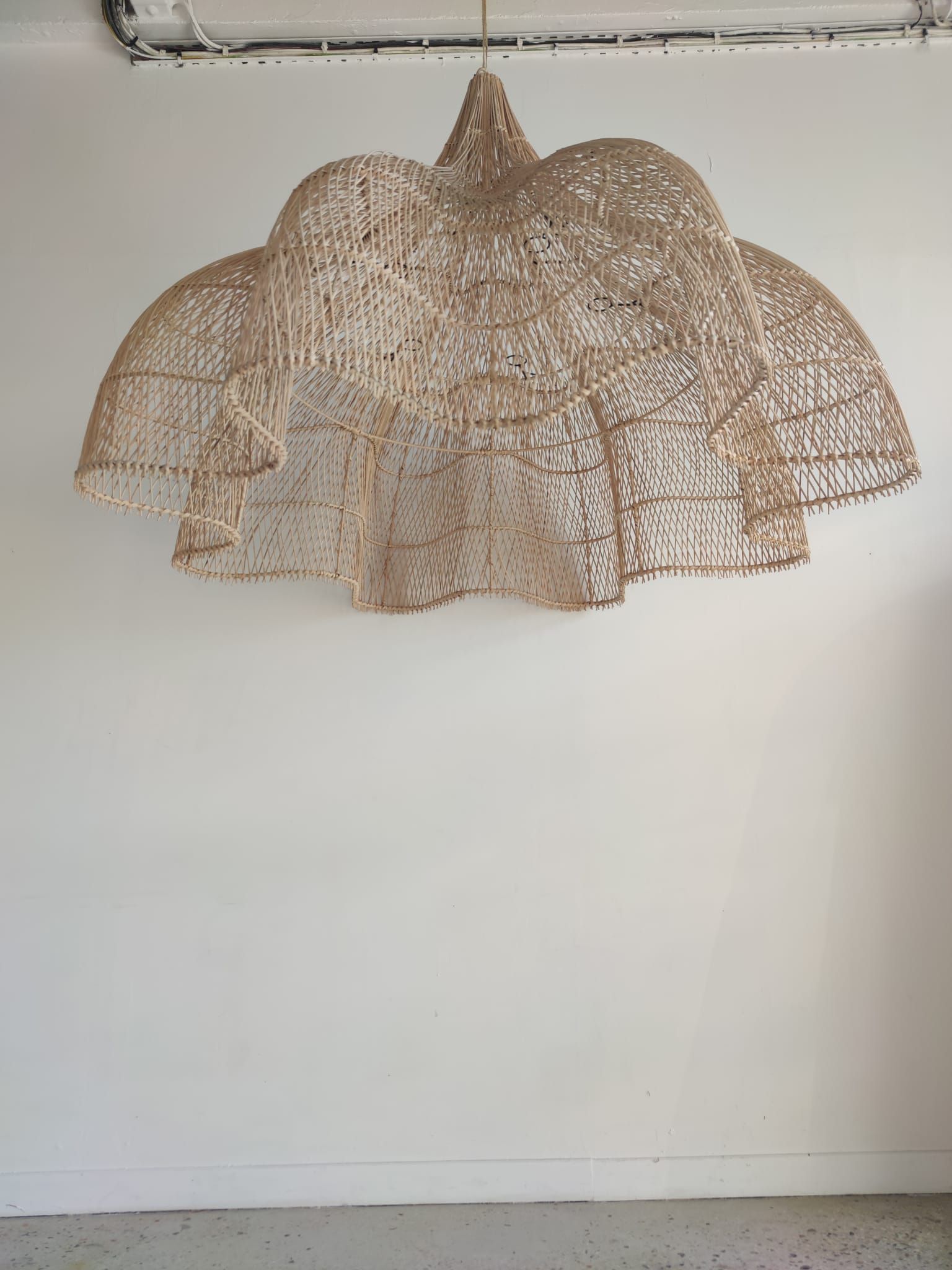 Huge rattan suspension in the shape of a corolla H:1m; D: 1m50
