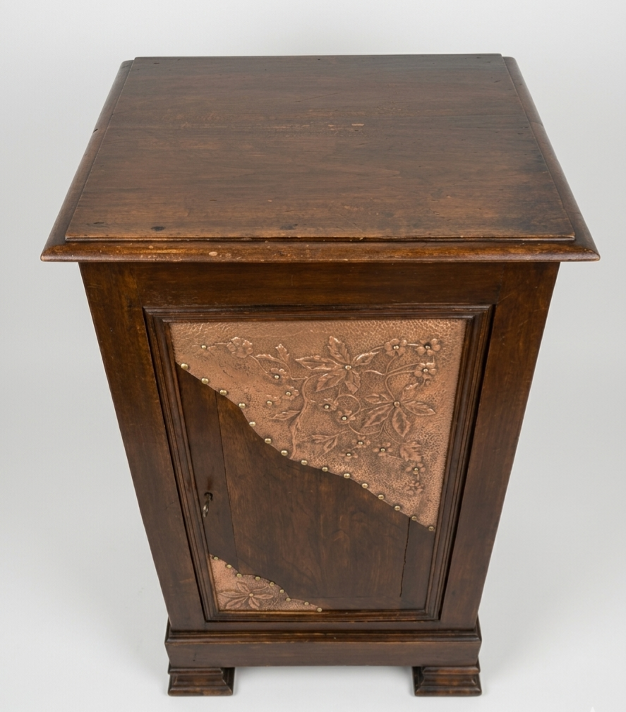 Small storage unit in solid wood and copper.