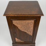 Small storage unit in solid wood and copper.