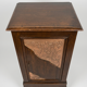Small storage unit in solid wood and copper.