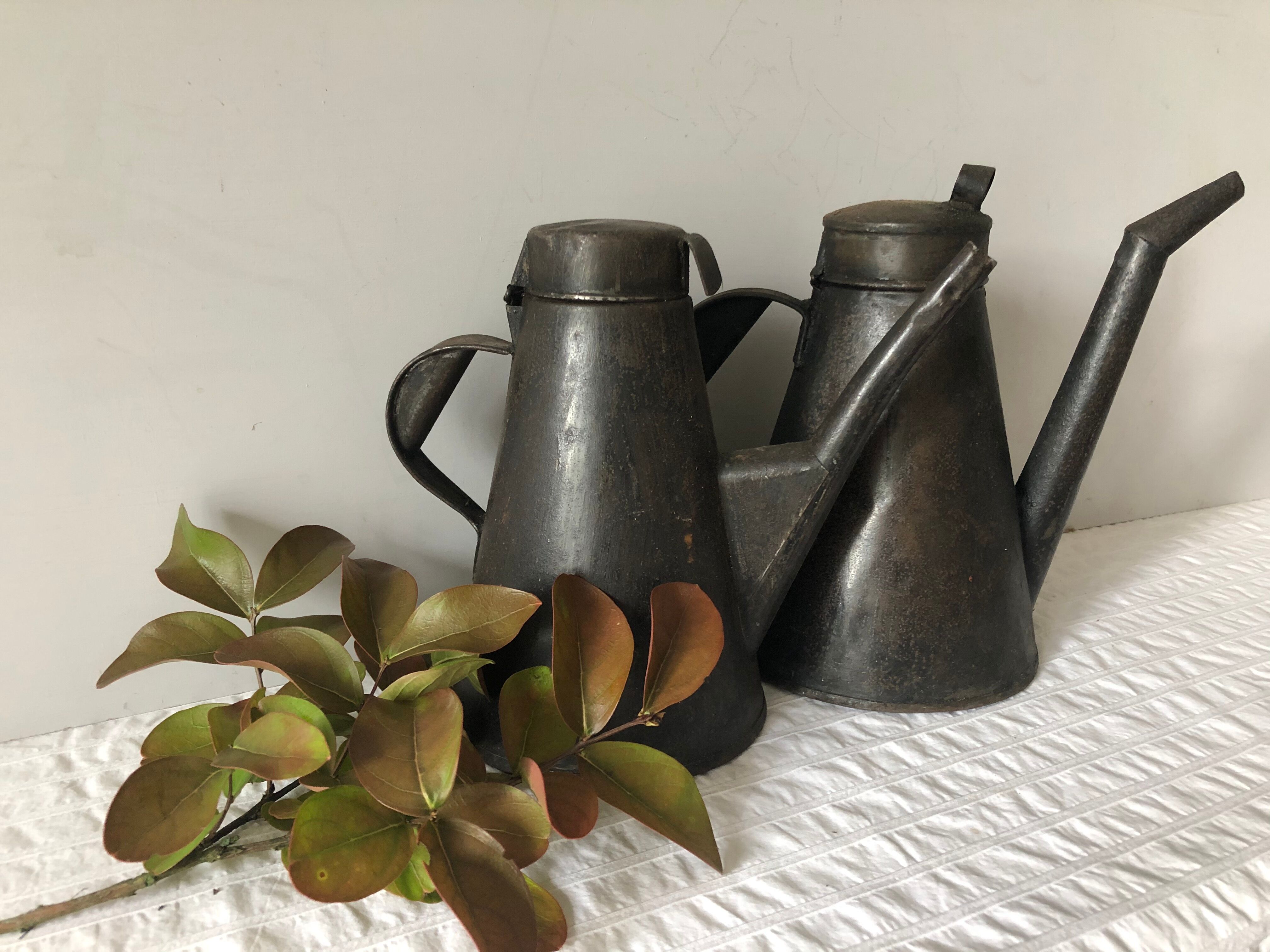Two workshop burettes, indoor watering cans