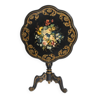 Painted side table with a bouquet of flowers decoration.