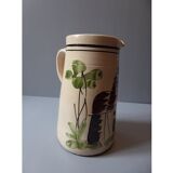 A pitcher in earthenware with a country décor