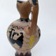 Clay pitcher with a bird head