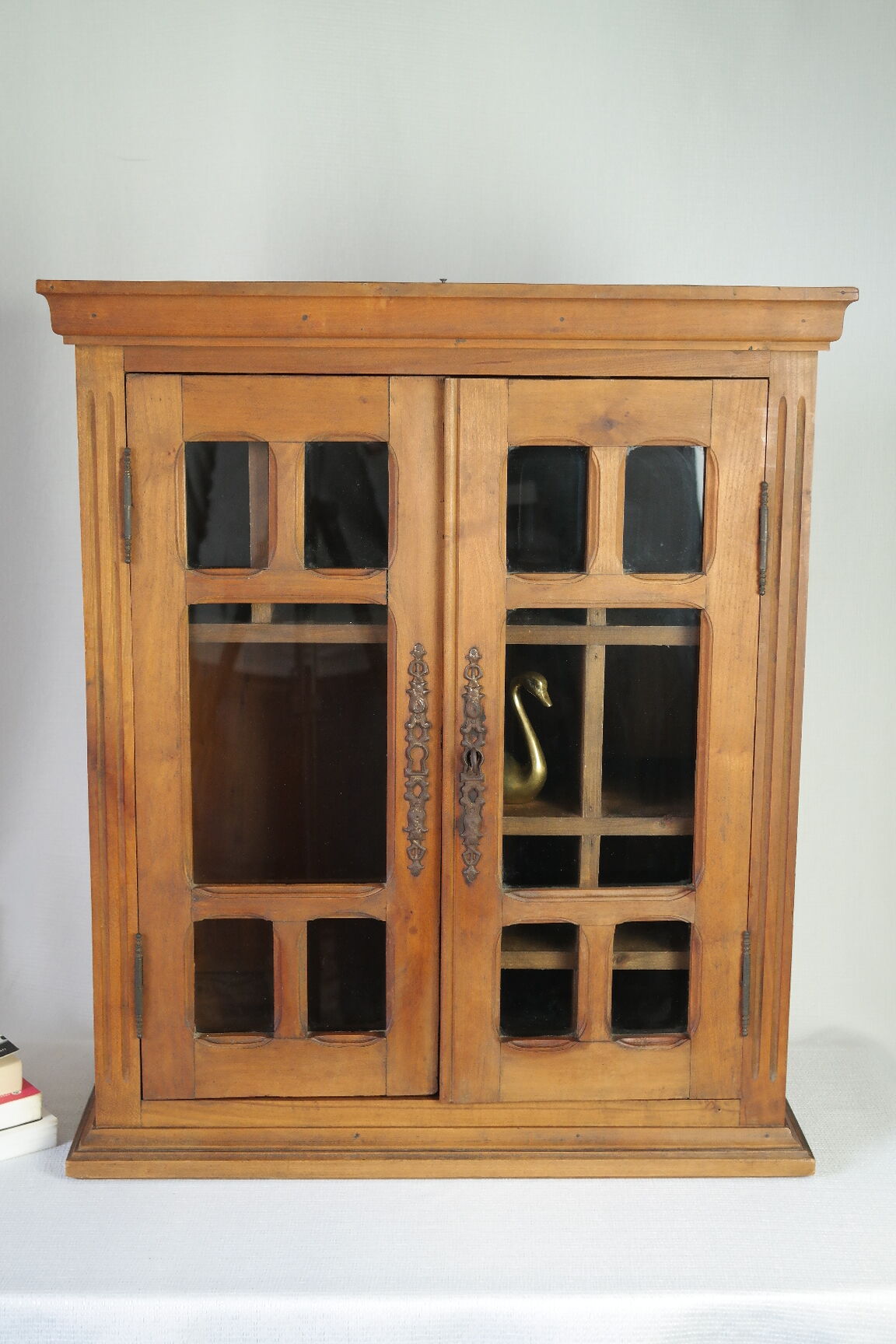 Antique walnut display cabinet from the 20th century.