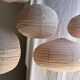 Grande suspension en rotin et lin naturel japonisante ovale aplatie rosée