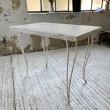 Perforated garden dining table