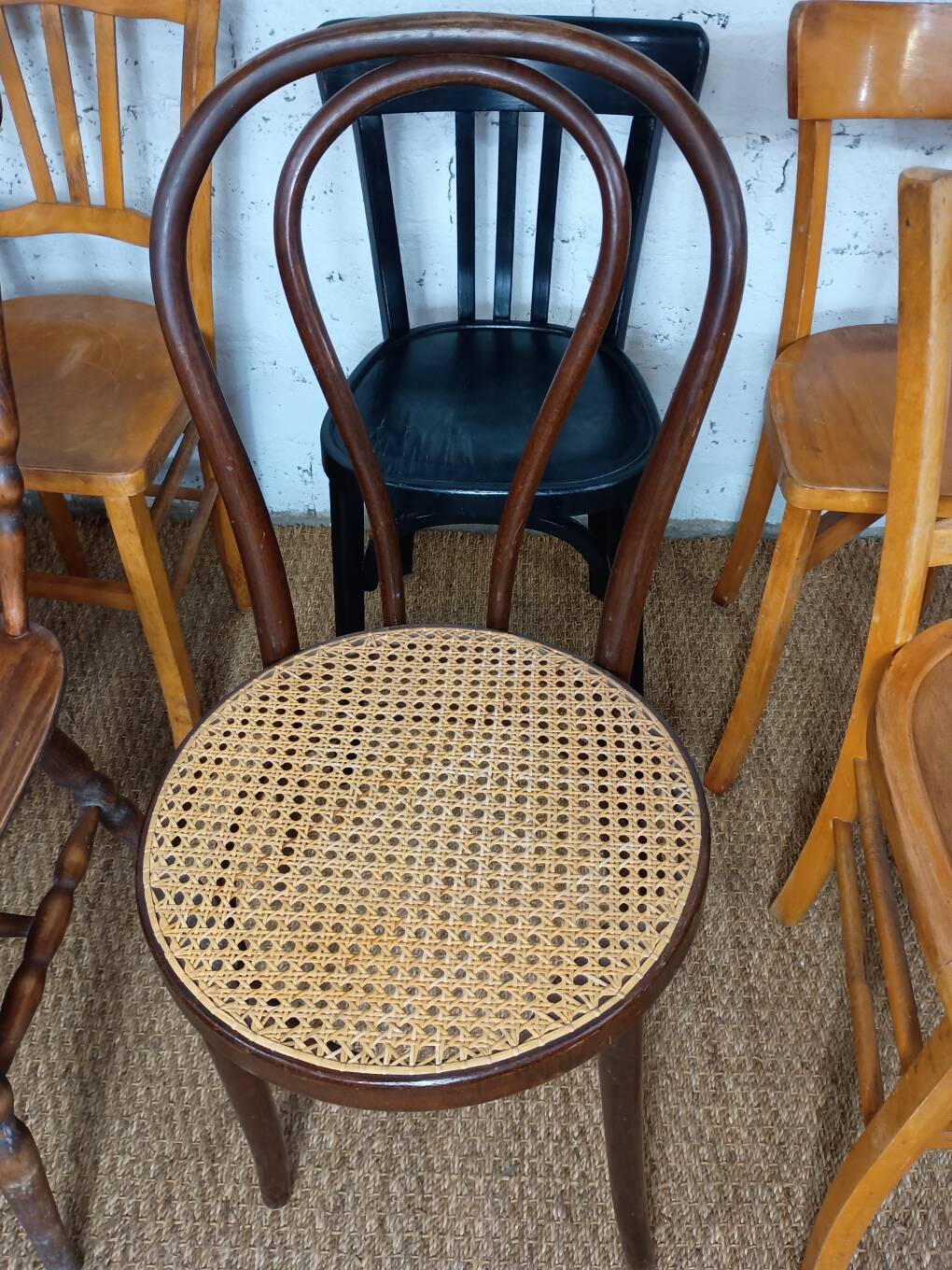 Set of 8 mismatched vintage Baumann Lebrun bistro chairs.