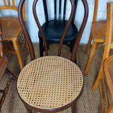 Set of 8 mismatched vintage Baumann Lebrun bistro chairs.