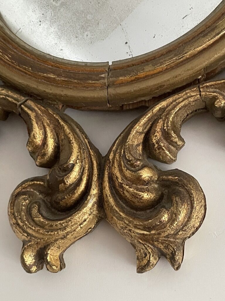 Old mirror in gilded wood