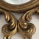 Old mirror in gilded wood