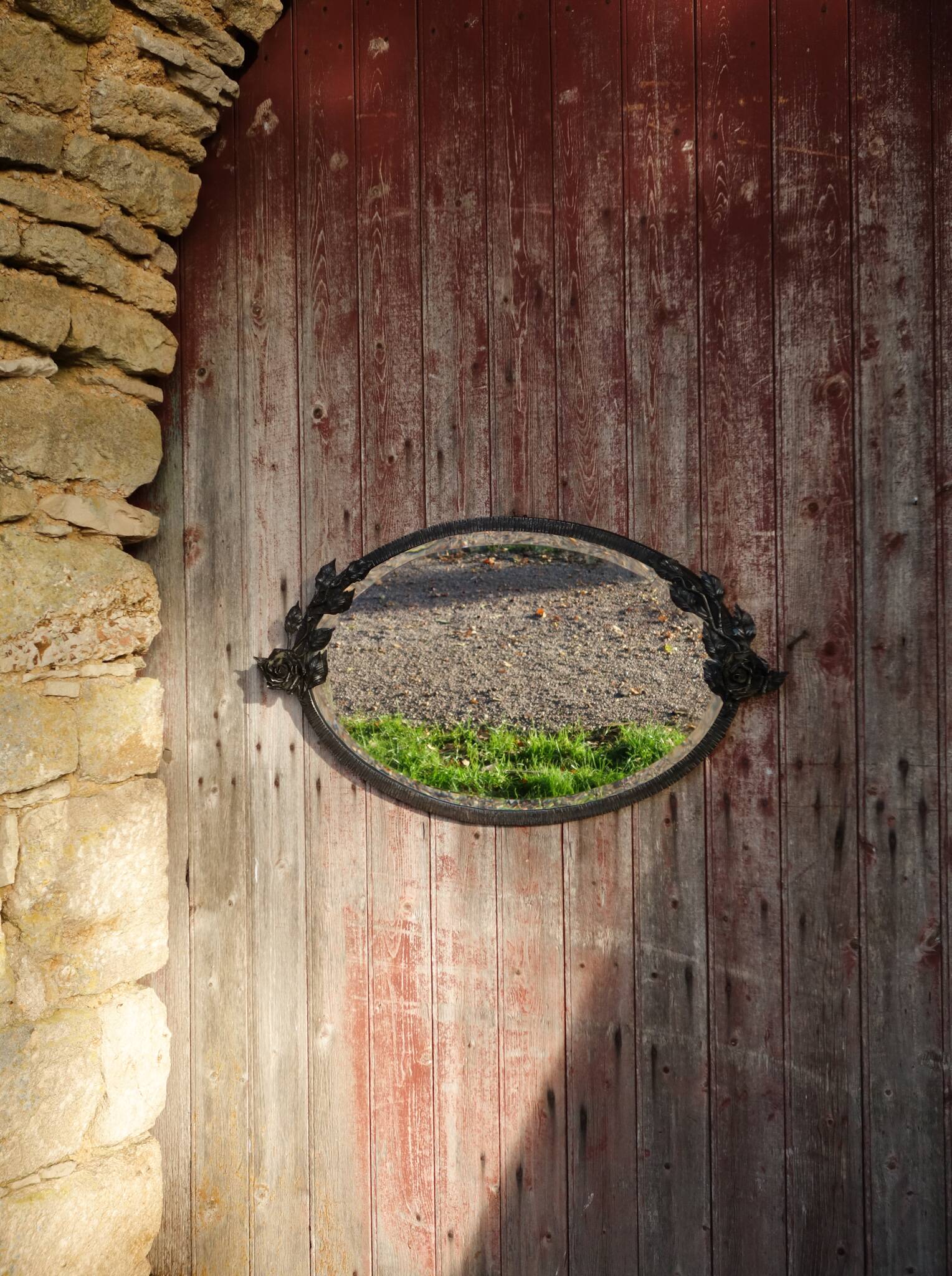 Art Deco mirror in wrought iron and beveled glass