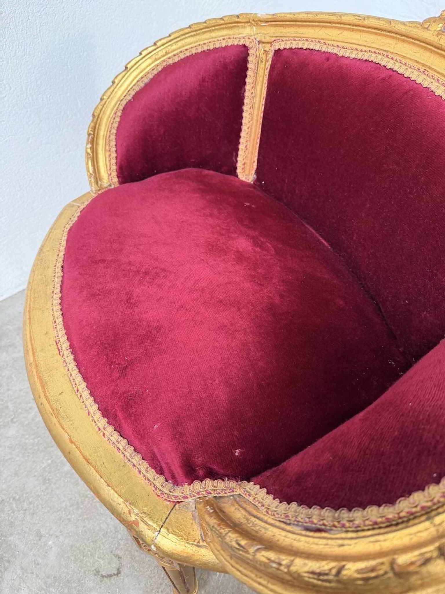 Louis XVI gilt wood and red velvet armchair