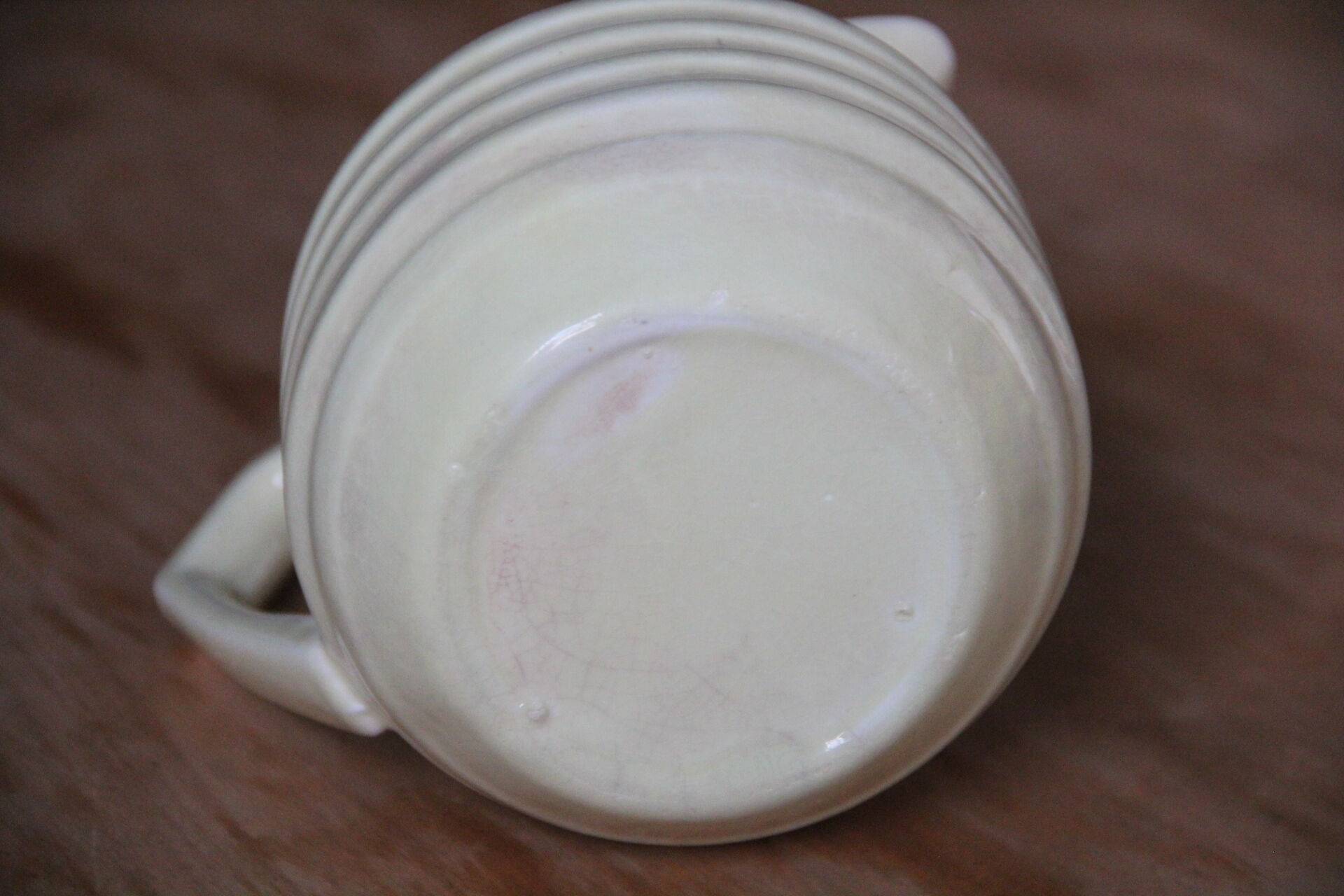 Art-deco pitcher in pale yellow earthenware