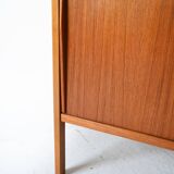 Scandinavian bookcase with storage compartment